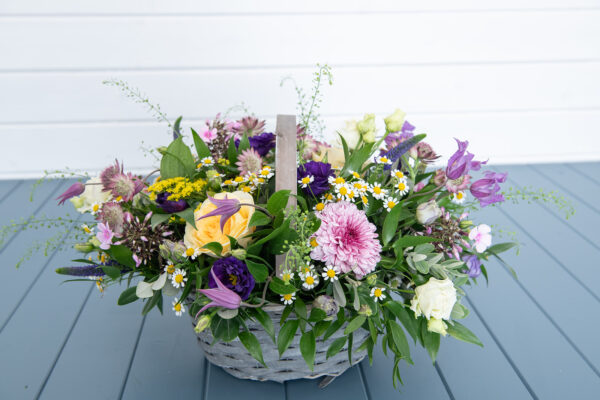 Colourful basket of mixed flowers